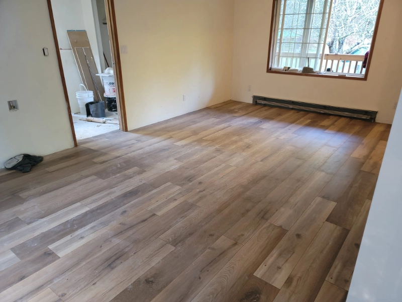 Completed natural wood flooring installation in an interior room