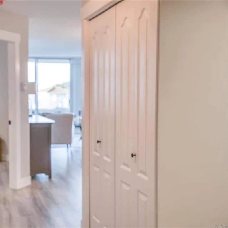 Completed interior doors and trim beside an open living space